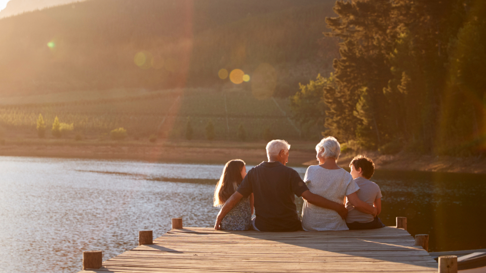 grandparents on jetty with grand children